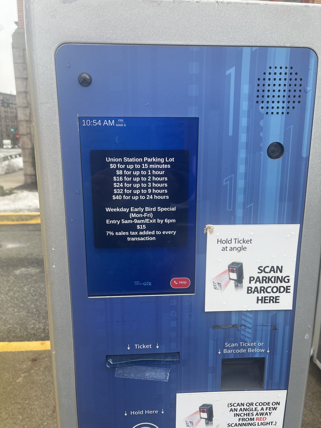 The parking pay station at the surface lot, with the barcode scanner and its Scan Parking Barcode Here sign on the right side of the machine